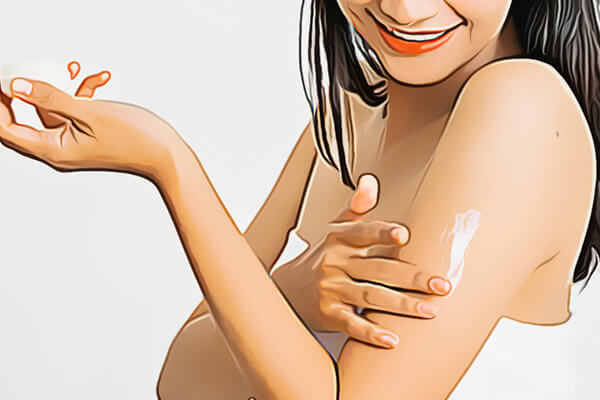 woman applying arm cream